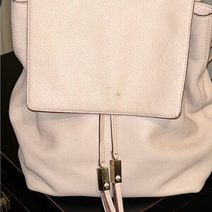 kate spade pale pink pebbled leather drawstring flap backpack with gold hardware